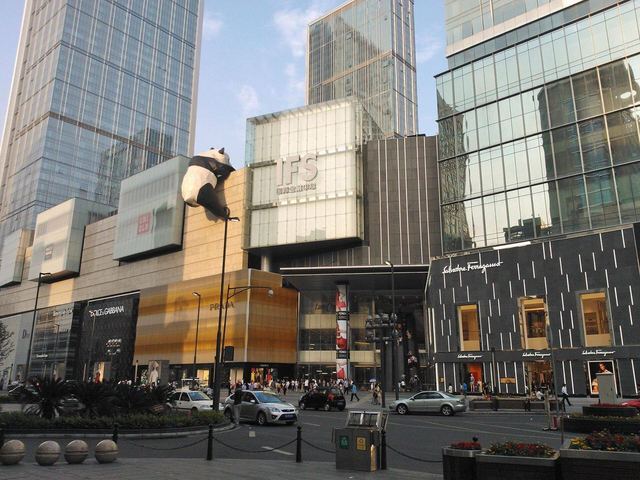The IFS towers and a giant panda sculpture climbing the mall's glass facade